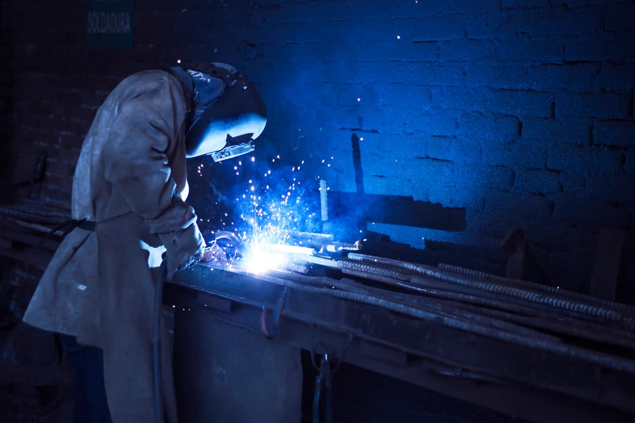a welder with safety gears on